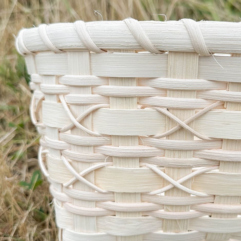 Cross-stitch napkin basket showing detail of the weaving pattern.