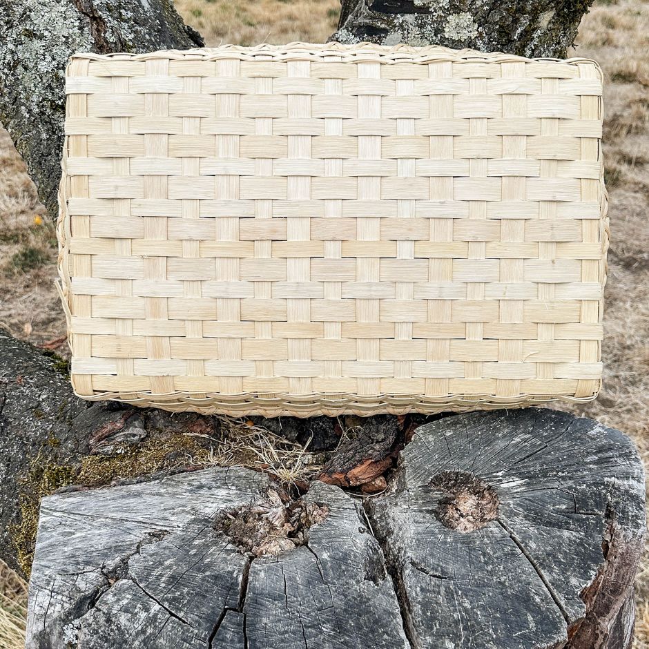 Bottom of a coffee table basket showing the closed weave style.