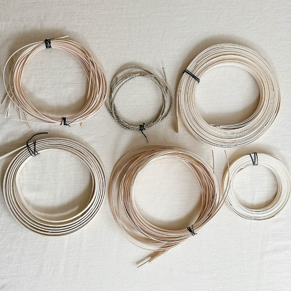Basket reed displayed on a linen tablecloth.