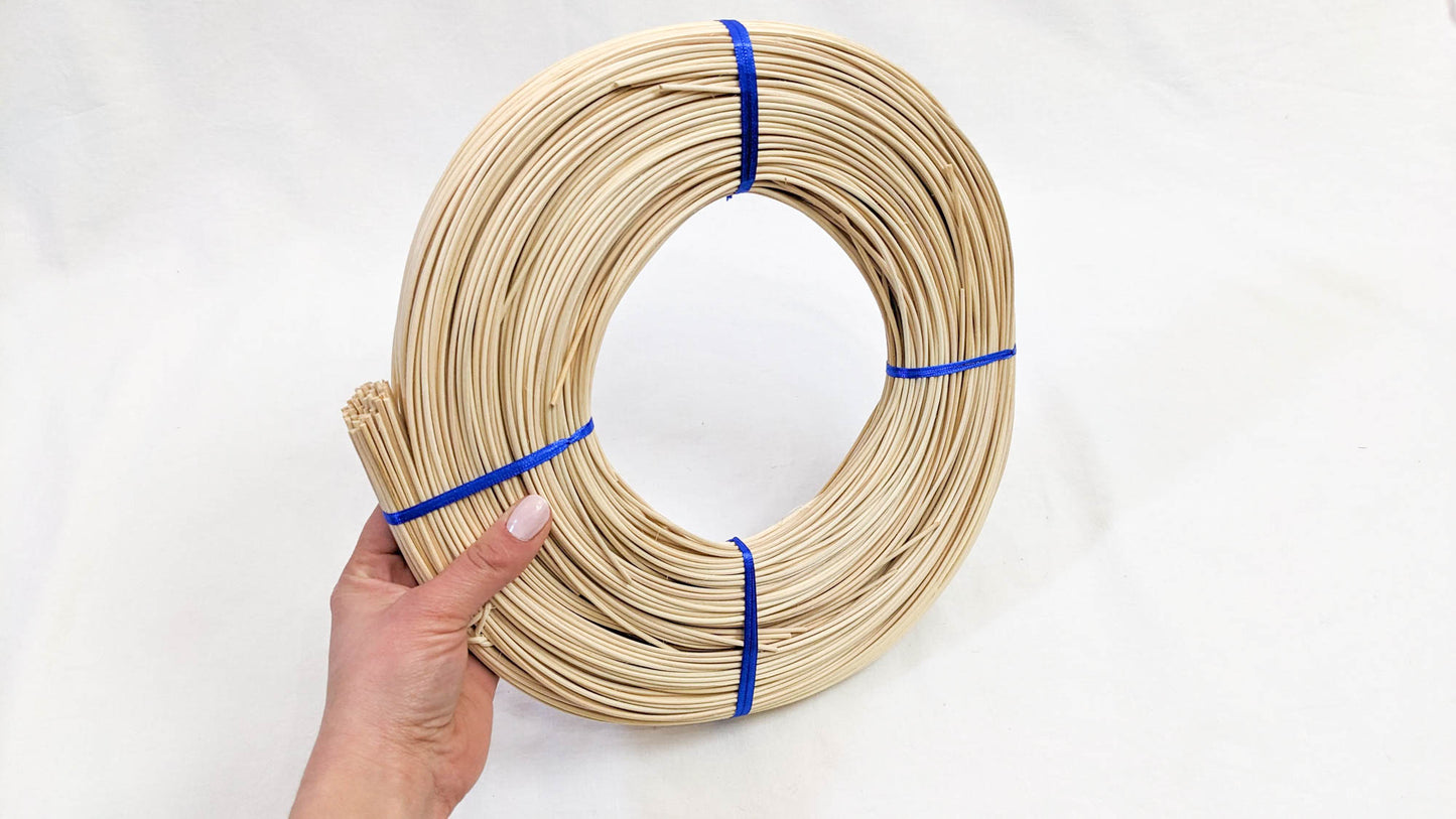 Woman's hand holding Round Reed #3 - 1 Pound Coil - Textile Indie