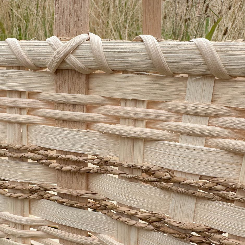 Detail image of a market basket with seagrass detailing. 