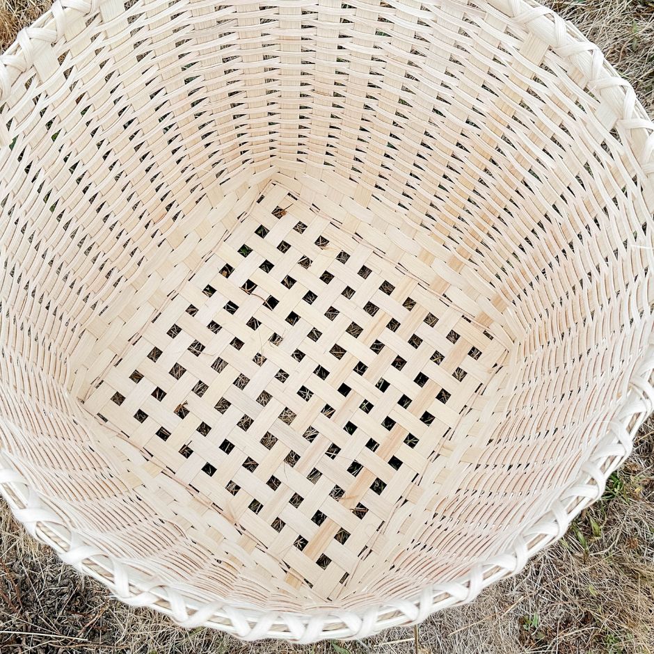 Top down detail view of the inside of a twill pattern blanket basket. 