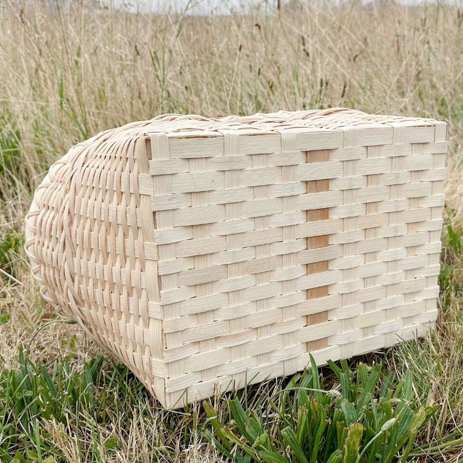 Bottom detail of a market basket showing the closed base weaving technique. 