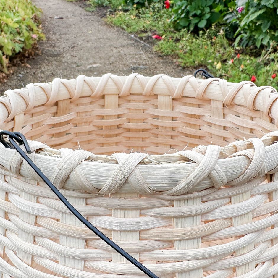 Detail image of the cross-hatch weaving on the rim of a bean pot basket. 