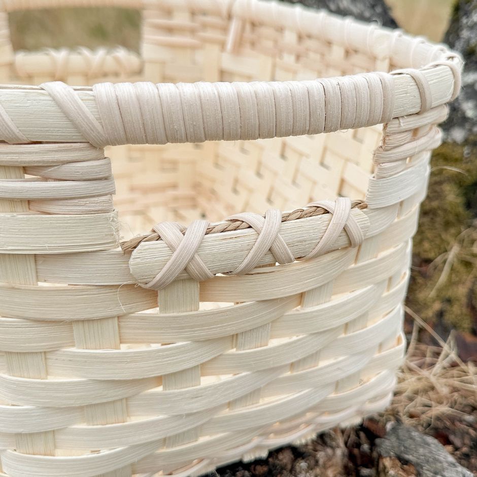 Detail image of the handled storage basket showing the wrapped handle technique.