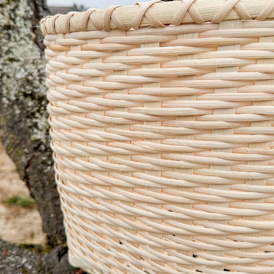 Detail walls of a twill Basket Blanket sitting in a tree.