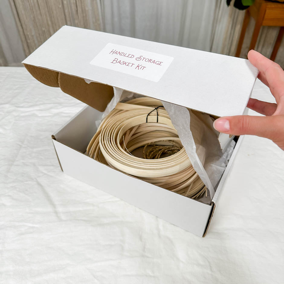 Load video: A boxed kit for the handled storage basket being opened.