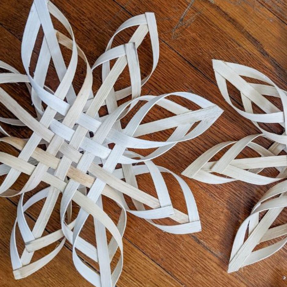 Load video: Scandinavian snowflakes against a wood background.